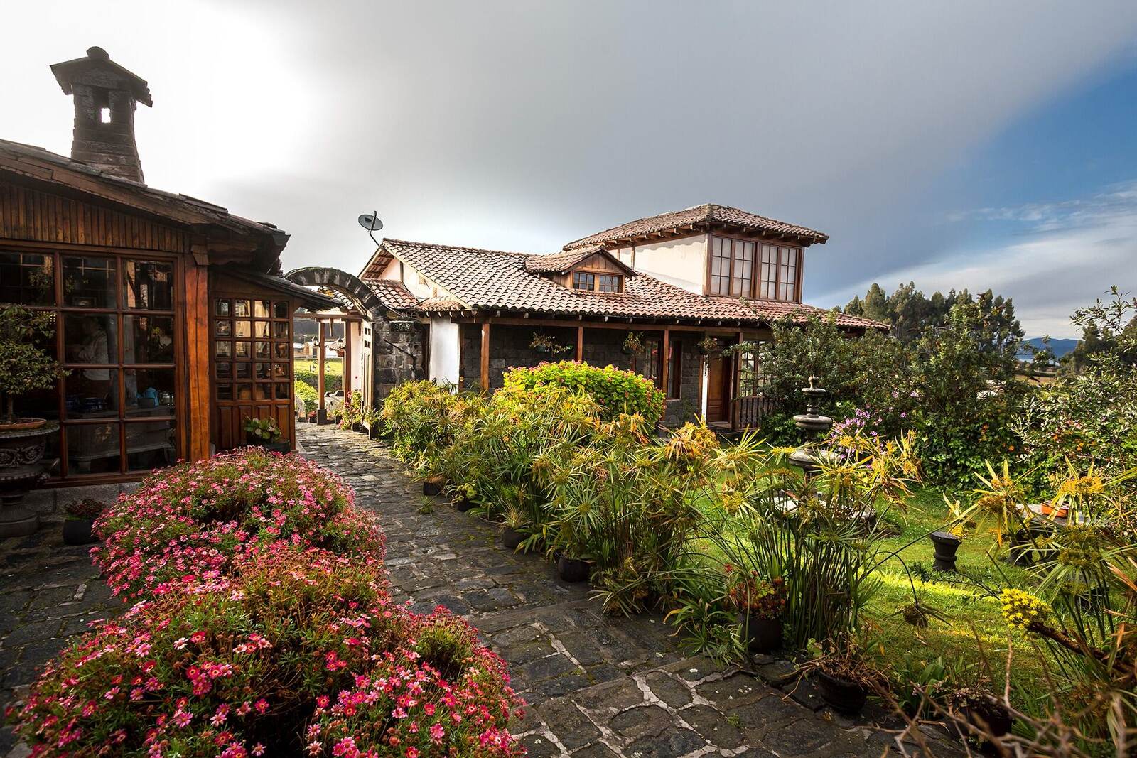 Colorful garden and traditional buildings at an Andean hacienda