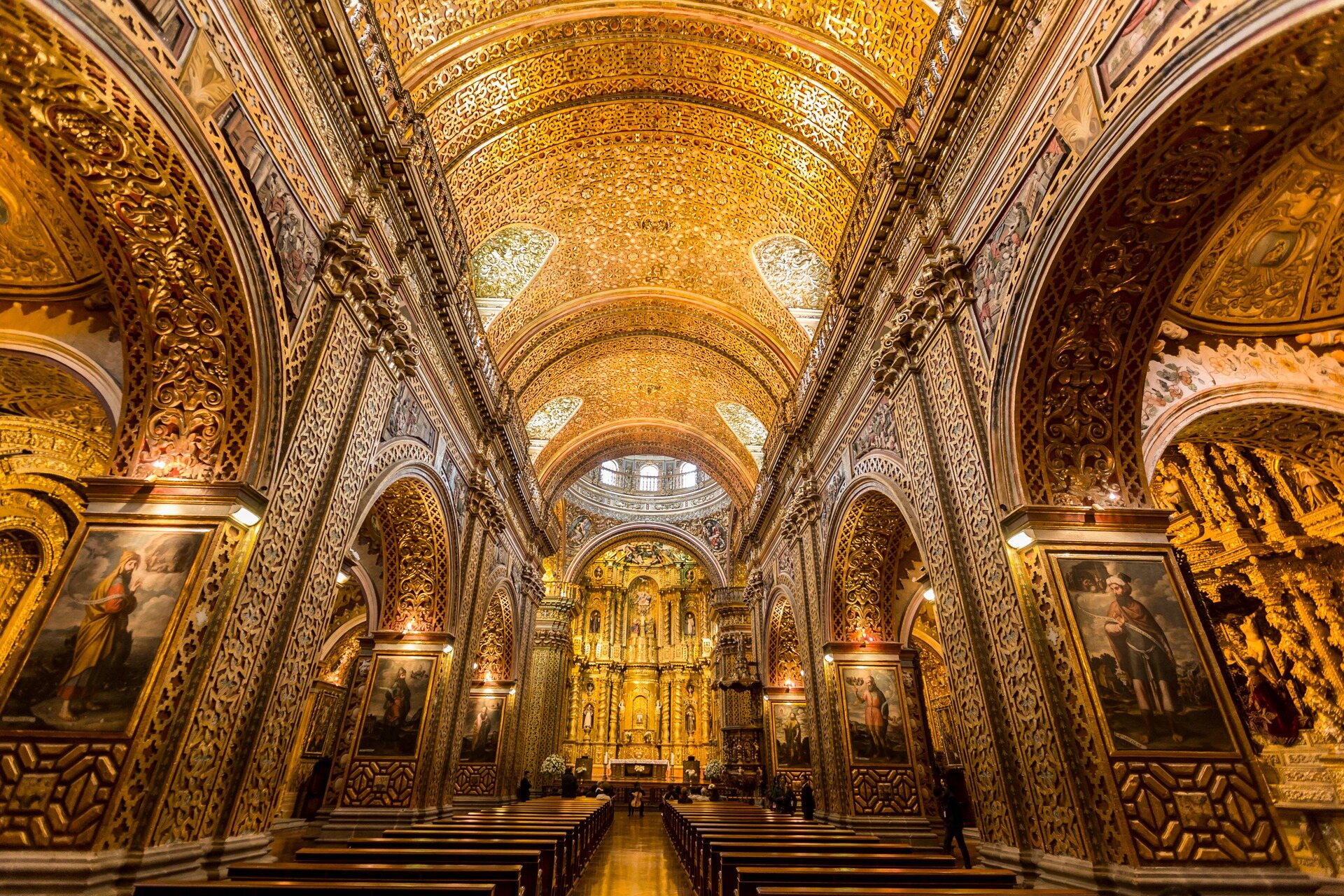 Ornate golden interior of a historic church in Quito