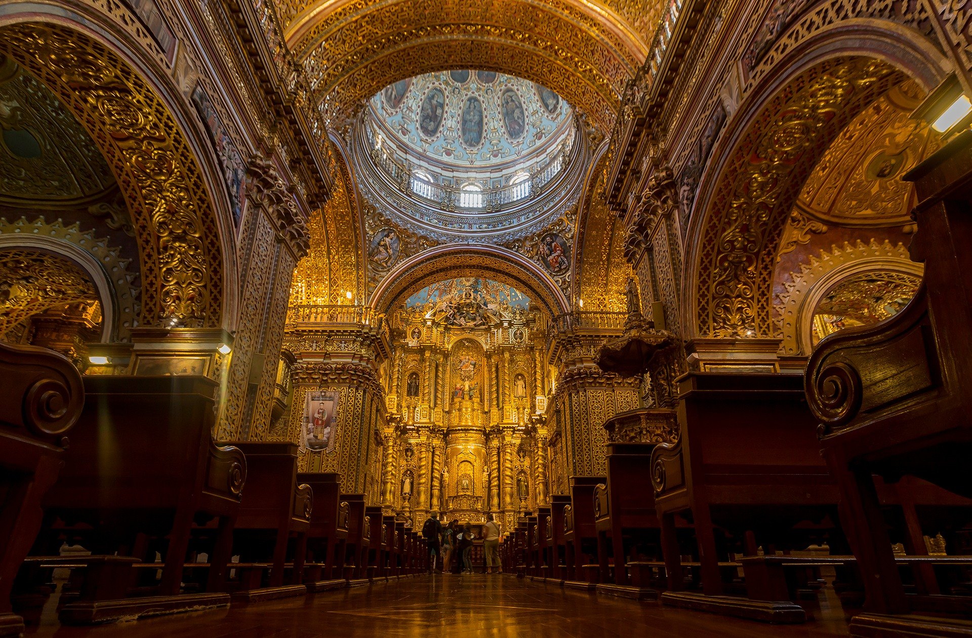 Golden Baroque interior of La Compania de Jesus church in Quito