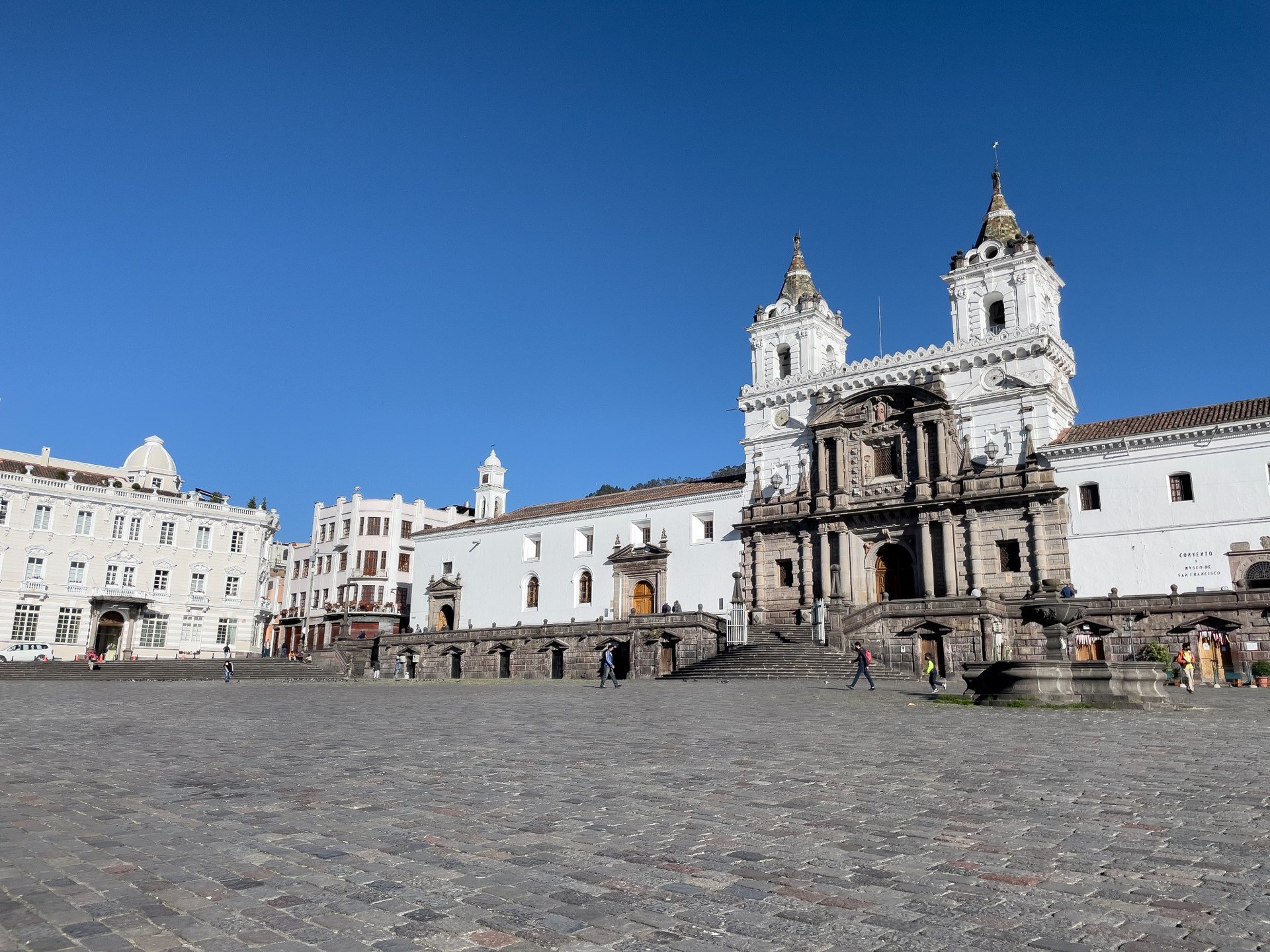 San Francisco Church and square in Quito historic center under a clear blue sky